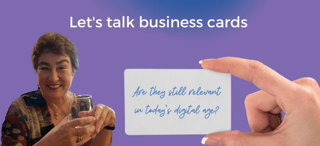 Lady holding glass and hand holding business card